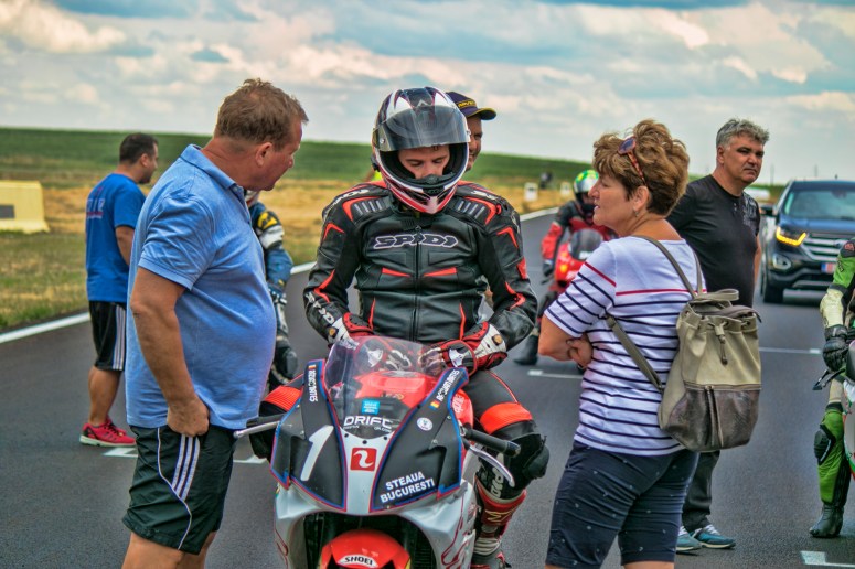 Razvan Mates racing at the East European Championship, 125SP category, before race pitlane with family