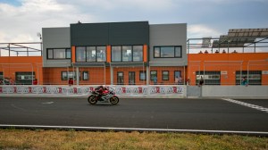 Razvan Mates racing at the East European Championship, 125SP category, straight line, in front of pitlane