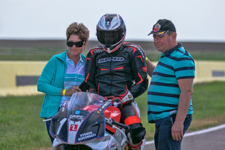 Razvan Mates racing at the East European Championship, 125SP category, before race pitlane with family