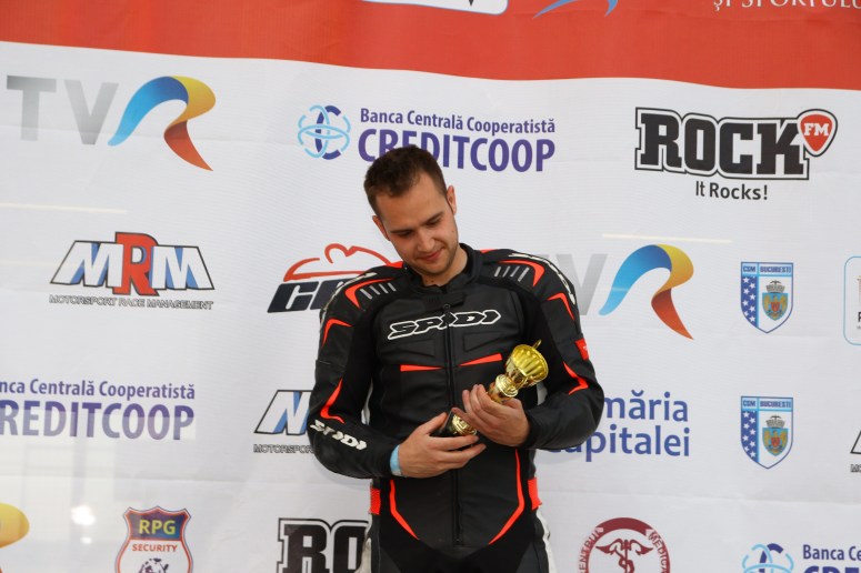 Razvan Mates racing at the East European Championship, 125SP category, ceremony, trophy, celebration