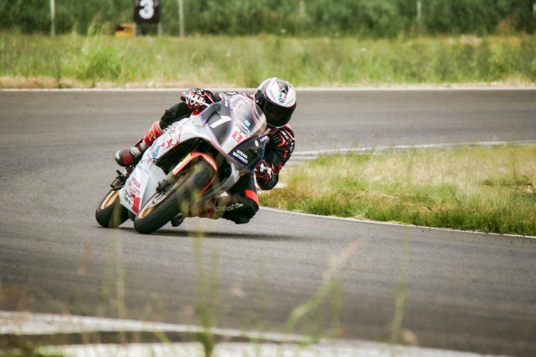 Razvan Mates racing racing the Aprilia bike at the East European Championship, 125SP category, final left turn